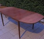 Extendable teak dining table